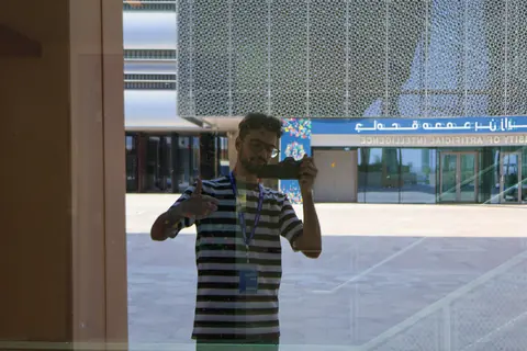 A reflection photo outside a university building